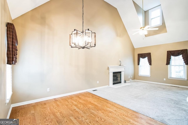1008 Walnut Creek Dr, Woodstock, GA 30188 - unfurnished living room featuring plenty of natural light, baseboards, and high vaulted ceiling