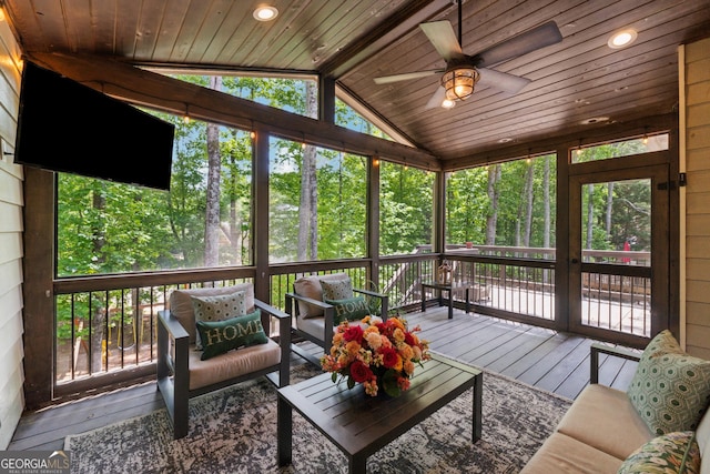 sunroom / solarium with a ceiling fan and outdoor lounge area