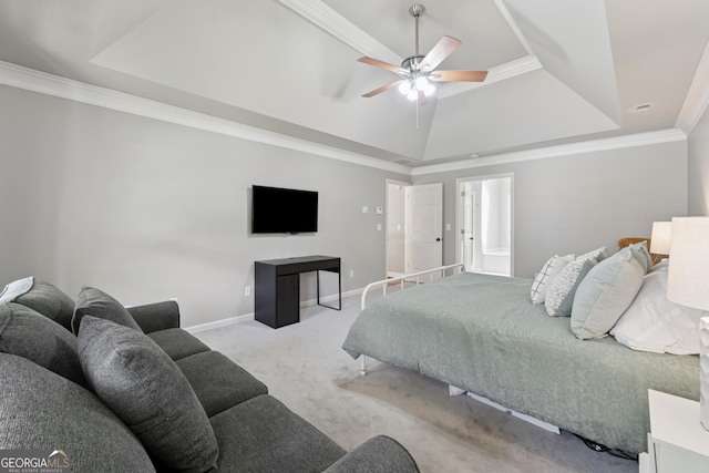 carpeted bedroom featuring baseboards, ornamental molding, ceiling fan, and a raised ceiling