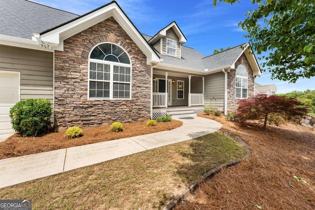 4572 Mulberry Fields Ln, Auburn, GA 30011 - view of front facade with roof with shingles, covered porch, and stone siding