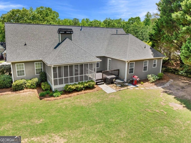 4572 Mulberry Fields Ln, Auburn, GA 30011 - back of property featuring roof with shingles, a lawn, a sunroom, and a deck