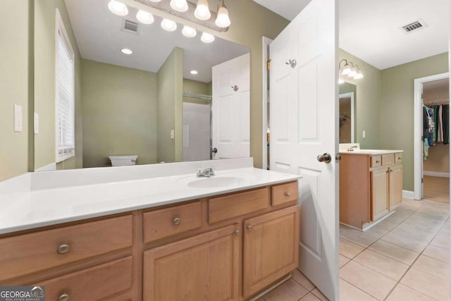 4572 Mulberry Fields Ln, Auburn, GA 30011 - full bathroom with vanity, tile patterned flooring, toilet, and visible vents