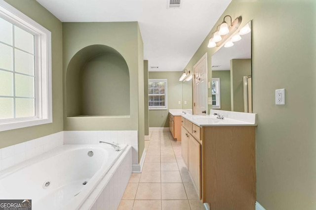 4572 Mulberry Fields Ln, Auburn, GA 30011 - bathroom with a sink, double vanity, tile patterned floors, baseboards, and a bath