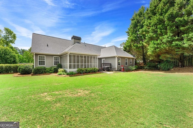 4572 Mulberry Fields Ln, Auburn, GA 30011 - rear view of property with a yard, a chimney, and a sunroom