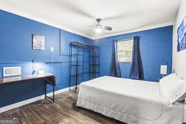 bedroom with a ceiling fan, visible vents, and wood finished floors