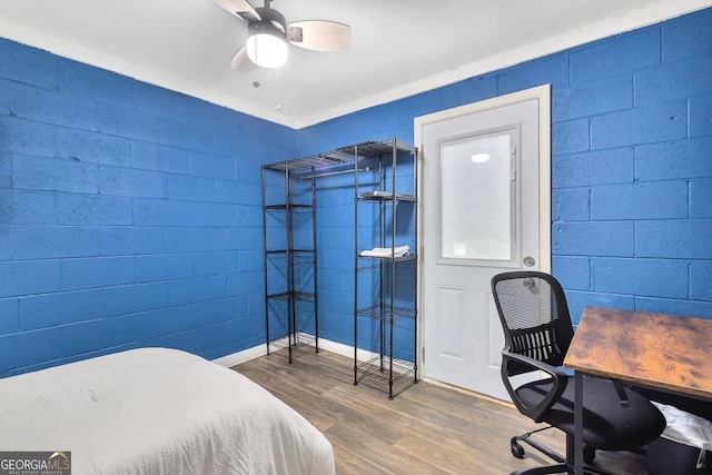 bedroom featuring a ceiling fan and wood finished floors