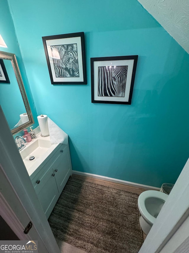 6444 Charter Way, Lithonia, GA 30058 - half bath with vanity, baseboards, and toilet