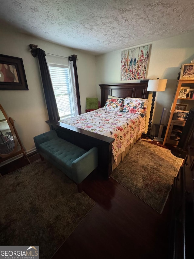 6444 Charter Way, Lithonia, GA 30058 - bedroom featuring a textured ceiling and wood finished floors