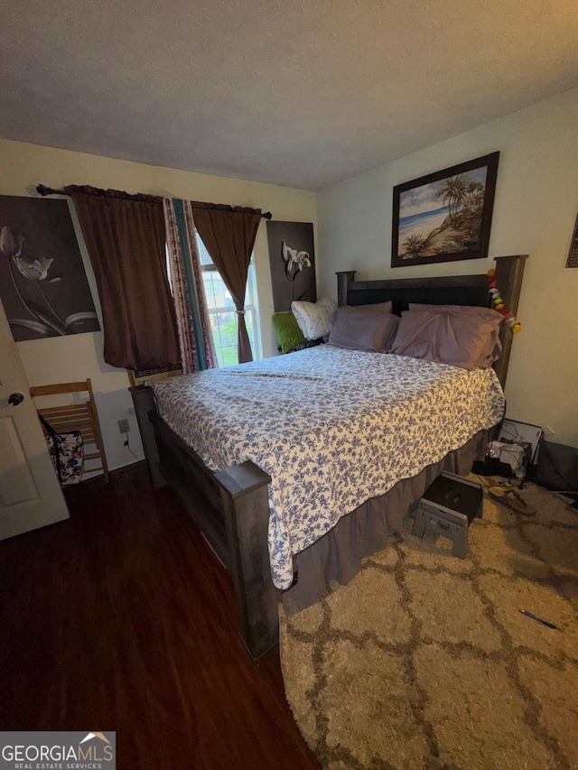 6444 Charter Way, Lithonia, GA 30058 - bedroom featuring a textured ceiling and wood finished floors