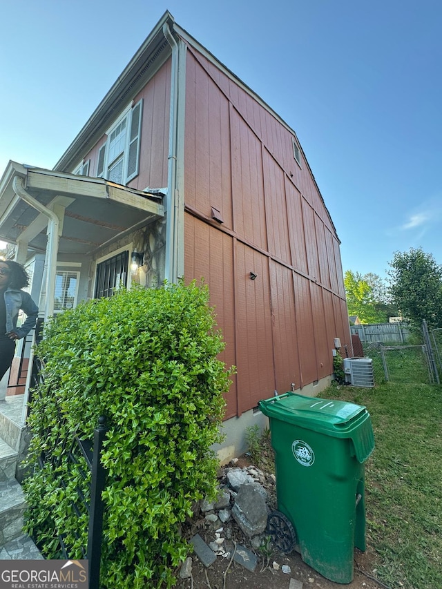 6444 Charter Way, Lithonia, GA 30058 - view of property exterior featuring central air condition unit, a lawn, and fence