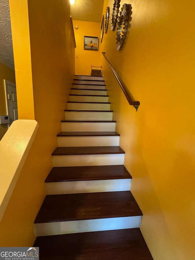 6444 Charter Way, Lithonia, GA 30058 - staircase featuring a textured ceiling and wood finished floors