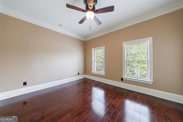 unfurnished room with crown molding, baseboards, ceiling fan, and dark wood finished floors