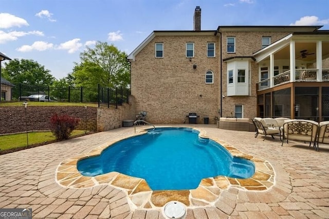view of pool with ceiling fan, a patio area, fence, a fenced in pool, and outdoor lounge area