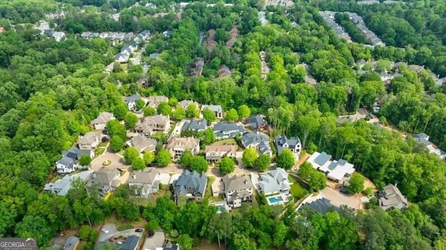 bird's eye view with a residential view and a wooded view