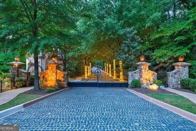 view of gate with fence