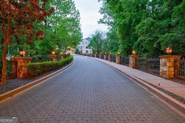 view of property's community with fence