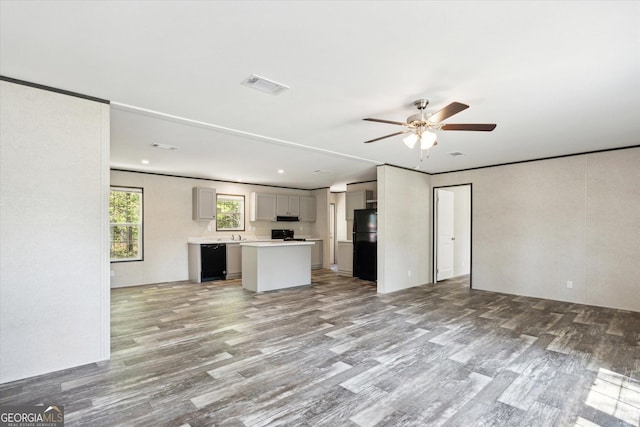 810 Simpsontown Rd, Newington, GA 30446 - unfurnished living room featuring ceiling fan, visible vents, and light wood finished floors