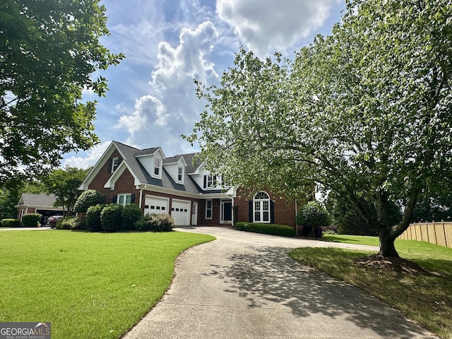 23 Saint Ives Ln, Winder, GA 30680 - cape cod home featuring concrete driveway, brick siding, fence, and a front yard