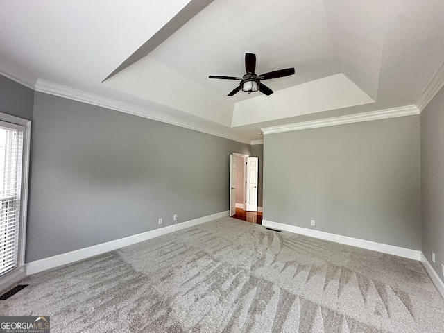 23 Saint Ives Ln, Winder, GA 30680 - spare room with a ceiling fan, visible vents, crown molding, carpet floors, and a tray ceiling