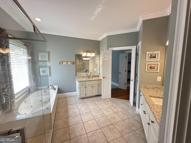 23 Saint Ives Ln, Winder, GA 30680 - full bath featuring a garden tub, ornamental molding, two vanities, a shower stall, and a sink