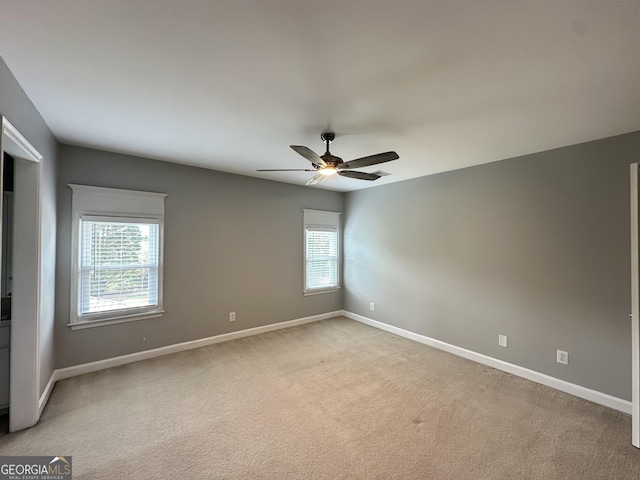23 Saint Ives Ln, Winder, GA 30680 - empty room with baseboards, a ceiling fan, and light carpet