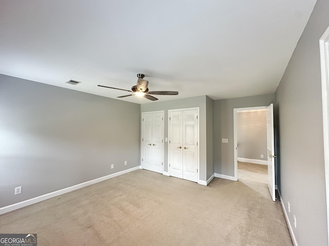 23 Saint Ives Ln, Winder, GA 30680 - unfurnished bedroom with visible vents, baseboards, carpet, and two closets