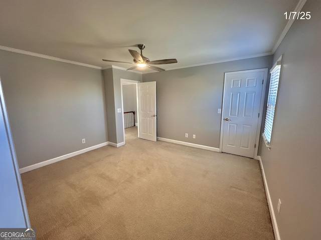 23 Saint Ives Ln, Winder, GA 30680 - unfurnished bedroom with baseboards, ornamental molding, light carpet, and a ceiling fan