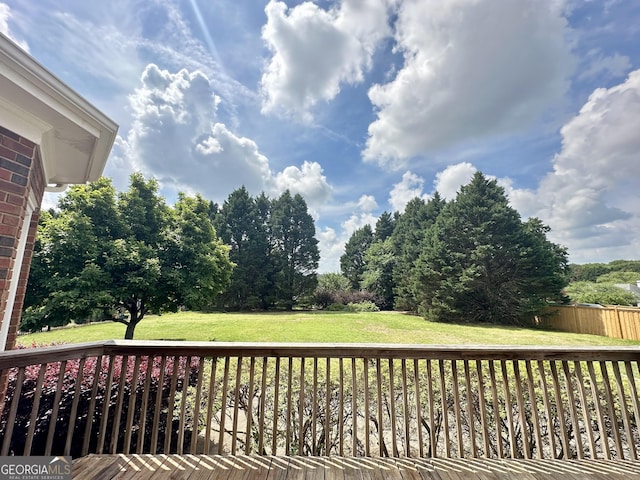 23 Saint Ives Ln, Winder, GA 30680 - wooden deck with a lawn and fence