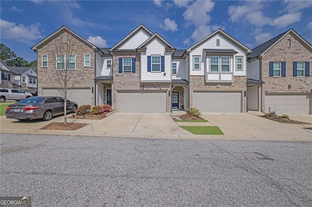 1386 Ben Park Way, Grayson, GA 30017 - multi unit property featuring stone siding, an attached garage, and driveway