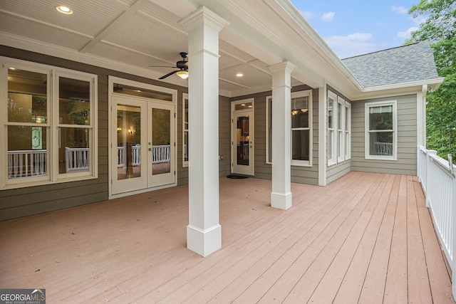 wooden terrace with a ceiling fan and french doors