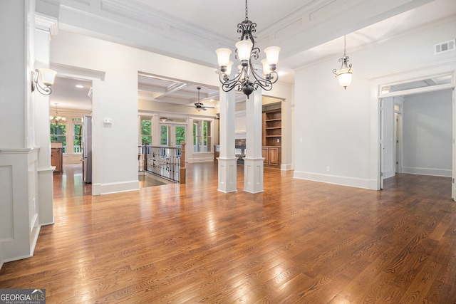 interior space featuring visible vents, ornamental molding, wood finished floors, french doors, and ceiling fan with notable chandelier