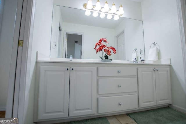 213 Shady Valley Dr, Carrollton, GA 30116 - bathroom with double vanity and tile patterned floors