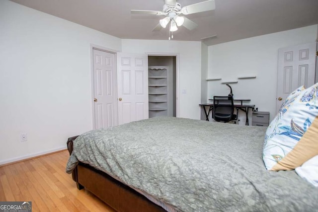 213 Shady Valley Dr, Carrollton, GA 30116 - bedroom with light wood finished floors and ceiling fan