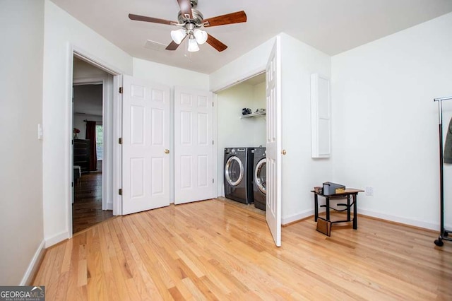 213 Shady Valley Dr, Carrollton, GA 30116 - laundry room with washer and clothes dryer, light wood-style flooring, and a ceiling fan