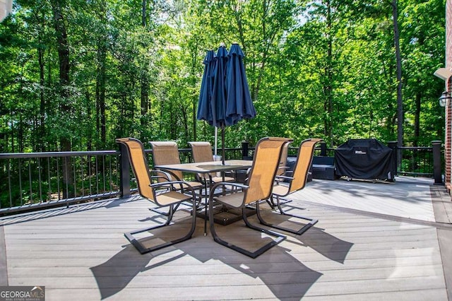 213 Shady Valley Dr, Carrollton, GA 30116 - wooden terrace with outdoor dining space and area for grilling