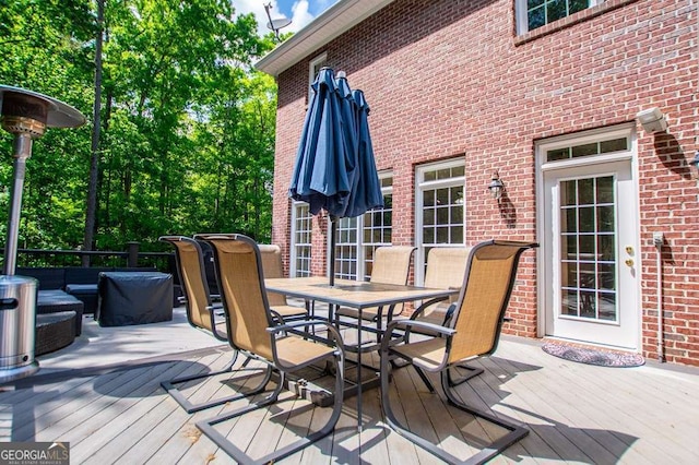 213 Shady Valley Dr, Carrollton, GA 30116 - deck with outdoor dining area and an outdoor living space
