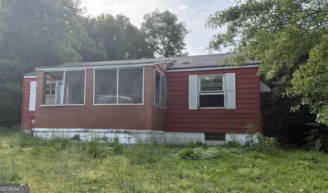 3766 Travis Blvd, Macon, GA 31206 - view of side of home with a sunroom
