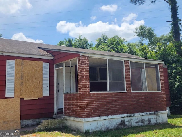 view of front of home with brick siding
