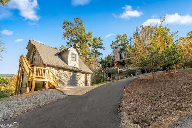 709 Laurel Creek Trl, Blue Ridge, GA 30513 - exterior space with roof with shingles, stairs, and driveway