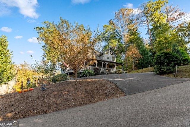 709 Laurel Creek Trl, Blue Ridge, GA 30513 - view of front of house featuring a porch and aphalt driveway
