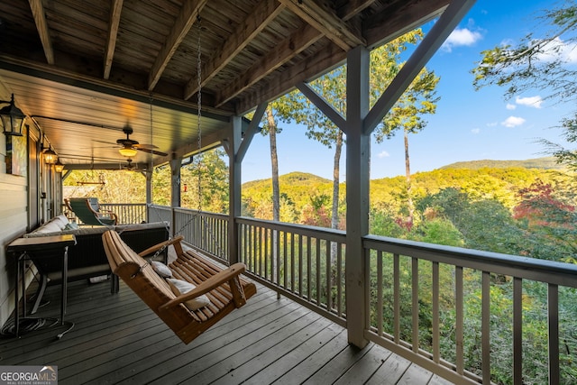 709 Laurel Creek Trl, Blue Ridge, GA 30513 - wooden deck with a forest view, a ceiling fan, and a mountain view