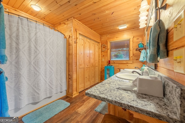 709 Laurel Creek Trl, Blue Ridge, GA 30513 - bathroom with vanity, wood finished floors, wooden walls, wooden ceiling, and a shower with curtain