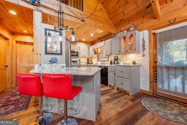 709 Laurel Creek Trl, Blue Ridge, GA 30513 - kitchen featuring appliances with stainless steel finishes, a sink, a kitchen breakfast bar, a peninsula, and wooden ceiling