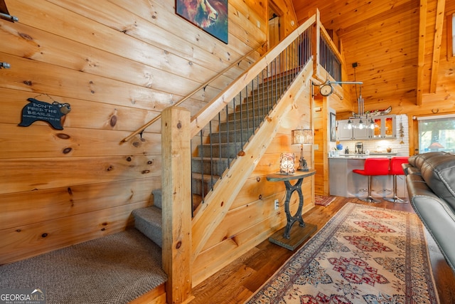 709 Laurel Creek Trl, Blue Ridge, GA 30513 - stairs with wooden walls, wood ceiling, and wood finished floors