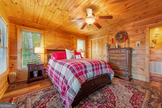 709 Laurel Creek Trl, Blue Ridge, GA 30513 - bedroom with wooden walls and wood finished floors