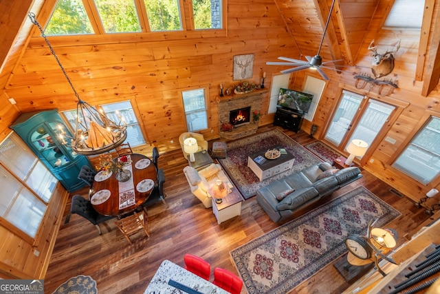 709 Laurel Creek Trl, Blue Ridge, GA 30513 - living area with plenty of natural light, wood finished floors, wooden walls, and high vaulted ceiling