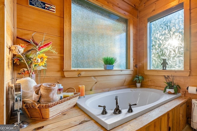 709 Laurel Creek Trl, Blue Ridge, GA 30513 - bathroom with wooden walls and a bath
