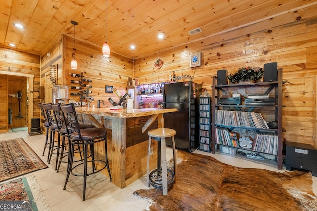 709 Laurel Creek Trl, Blue Ridge, GA 30513 - bar featuring freestanding refrigerator, wood ceiling, bar area, and wood walls