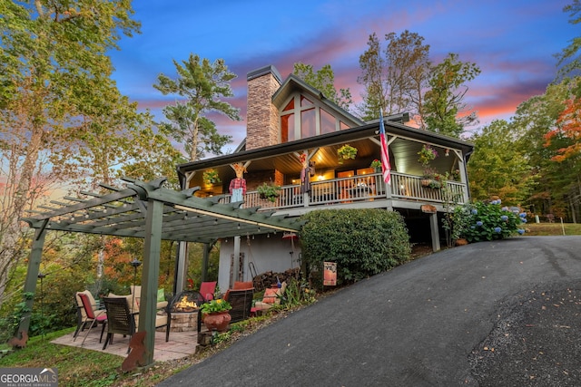 709 Laurel Creek Trl, Blue Ridge, GA 30513 - view of front of house featuring an outdoor fire pit and a chimney
