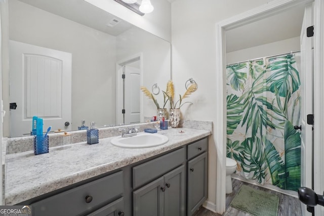 11028 Southwood Dr, Hampton, GA 30228 - full bathroom with toilet, curtained shower, and vanity